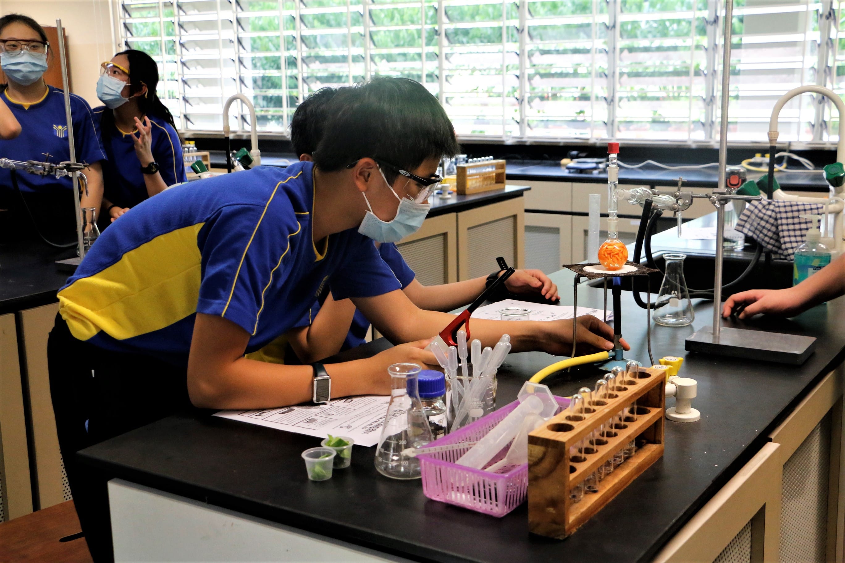 Sec 2 students in the Science Lab, engaged in their BC week activity.